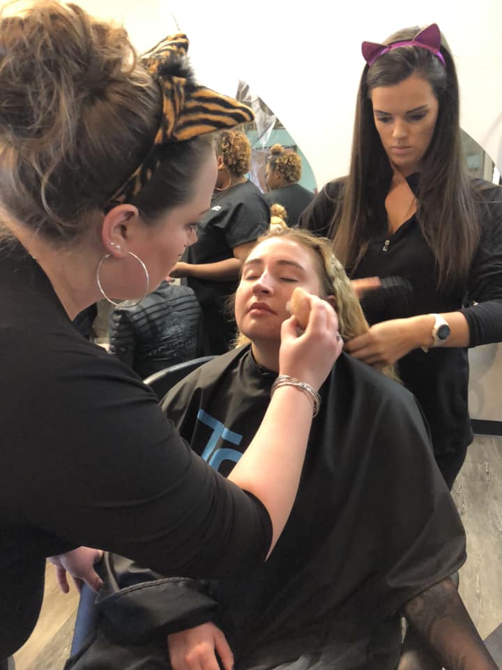 Makeup being applied to girl